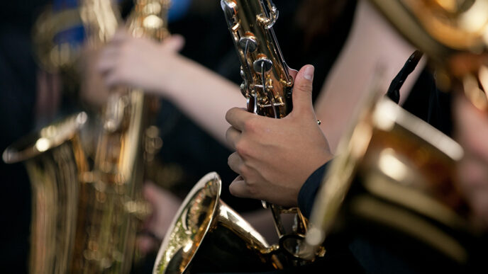 Detail of students’ hands playing saxophones