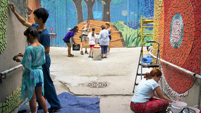 Young volunteers construct a large