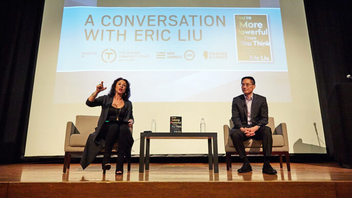 Maria Hinojosa and Eric Liu seated on stage|Maria Hinojosa and Eric Liu photographed from behind