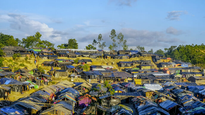 Rows of tents and bamboo shelters
