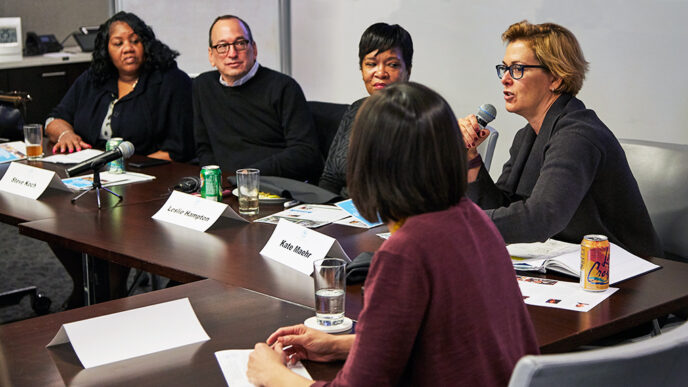 A group of panelists seated at a long conference table|A group of panelists seated at a long conference table|A group of panelists seated at a long conference table|A panelist speaks into a microphone|A group of panelists seated at a long conference table||Map of the Chicago region showing rates of food insecurity||