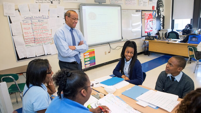 A man stands in a classroom