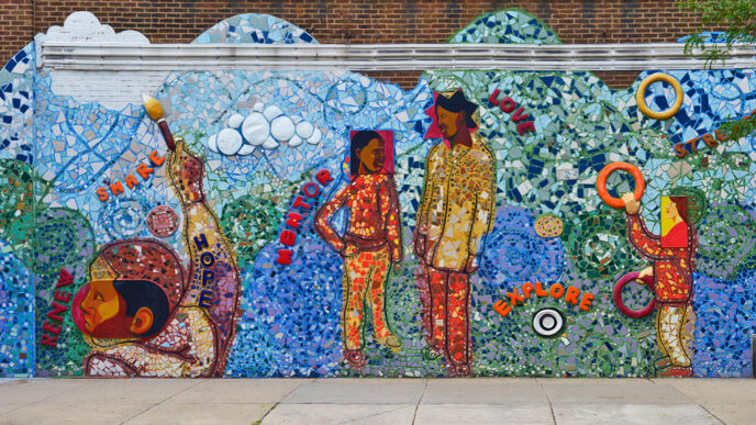 A colorful mural depicting people playing