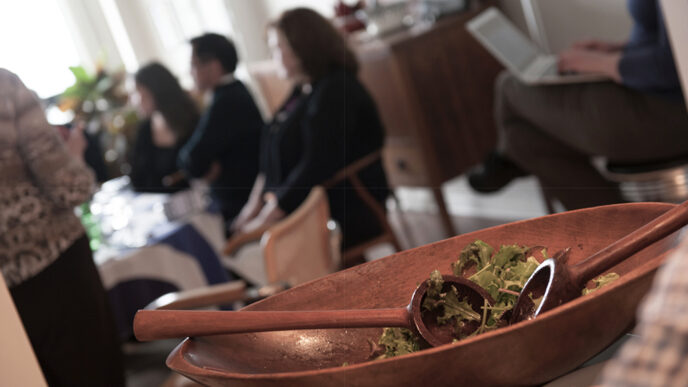 A salad bowl in the foreground