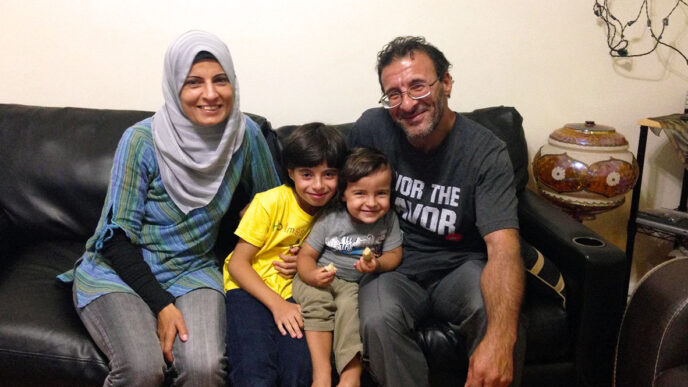 Fatima Adris with her husband Fadi and sons Abdel Hamid (left) and Osama|Suzanne Akras Sahloul of the Syrian Community Network