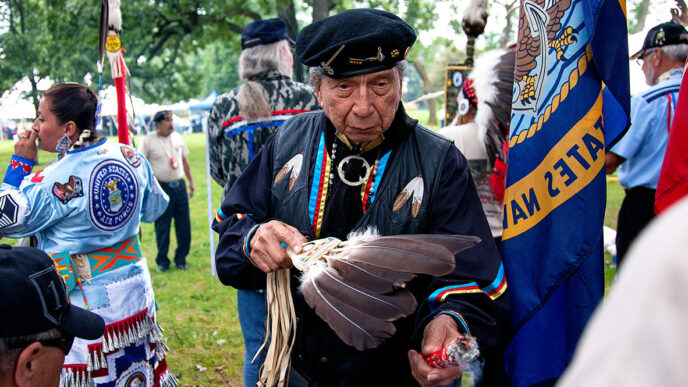 Surrounded by veterans in uniform