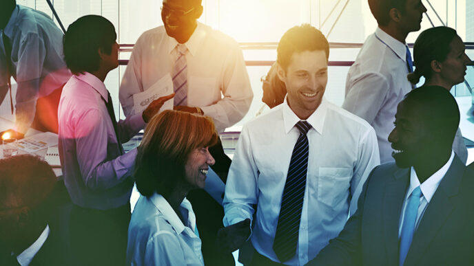 Professionals talking and laughing together in an office|Ring charts showing the racial and ethnic representation in Chicago's population