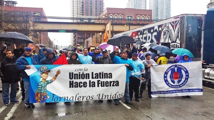 Workers and organizers with Latino Union at a May Day march downtown|Tom Long|Mechthild Hart|Aurelia Aguilar with her niece Mari