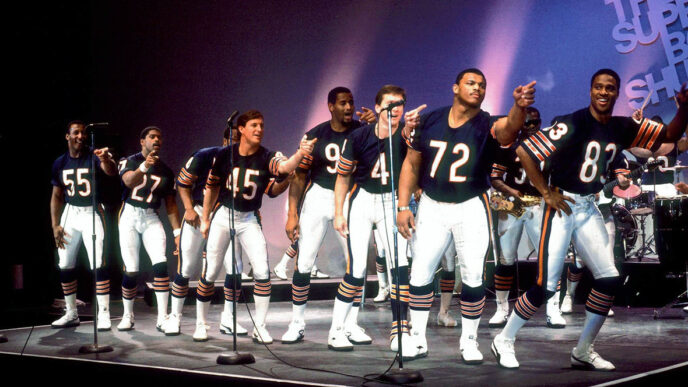 The Chicago Bears' 1986 champion lineup on stage performing The Super Bowl Shuffle|