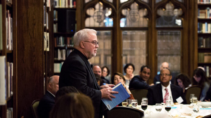 Rev. Jim Wallis addresses a group of Chicago civic leaders over dinner