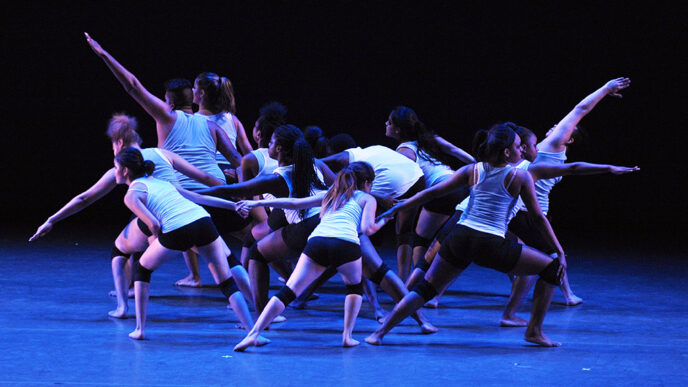 A teen dance troupe performs a contemporary-style routine on the Harris Theater stage at the Chicago Dancing Festival