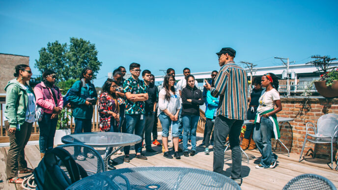 A group gathers on a Rogers Park rooftop