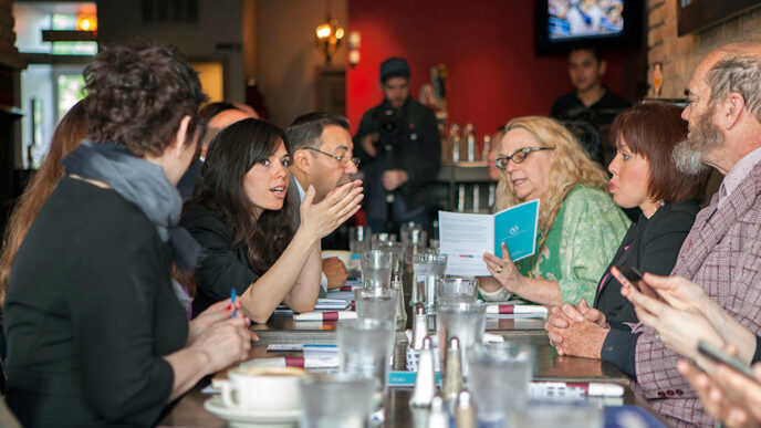 Guests talk over breakfast at an On the Table event