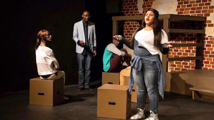 Four young performers on a stage|