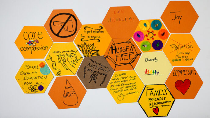 Kids at the Honeycomb Project event write and draw their hopes for Chicago to form a construction paper collage|A police officer in conversation with a neighbor at the breakfast table|Three women of different generations in conversation|A woman holds up a graphic depicting the difference between 'equality' and 'equity'|Two hundred guests seated at a long rooftop table