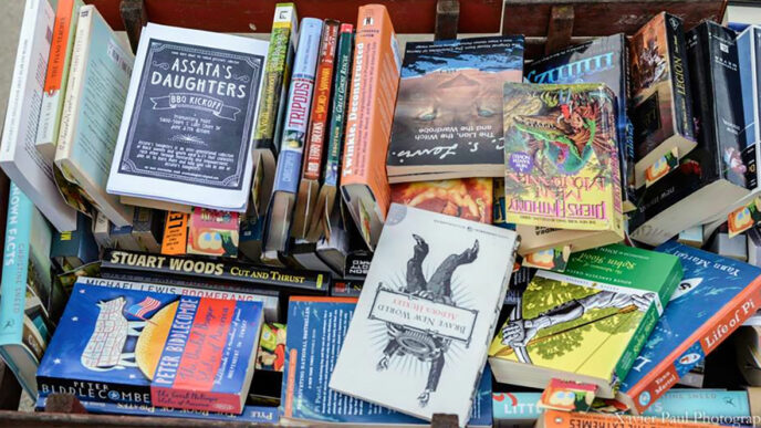 A box of assorted books|Clothing