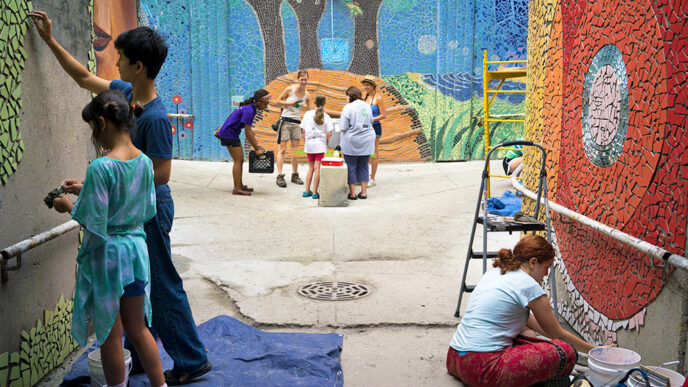 Young volunteers construct a large