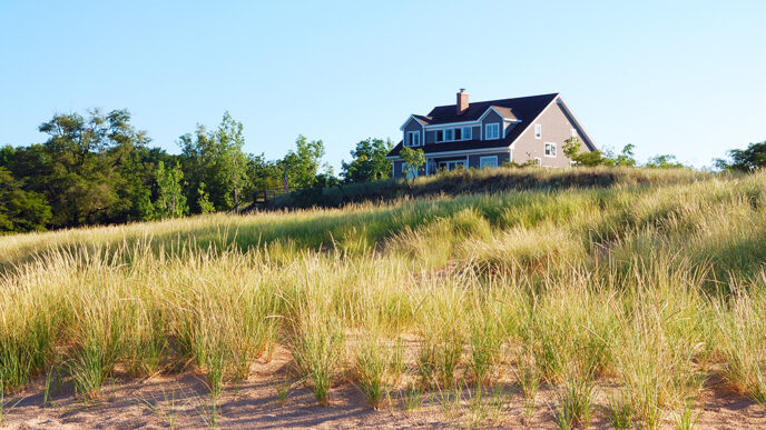 Vacation home among grassy dunes
