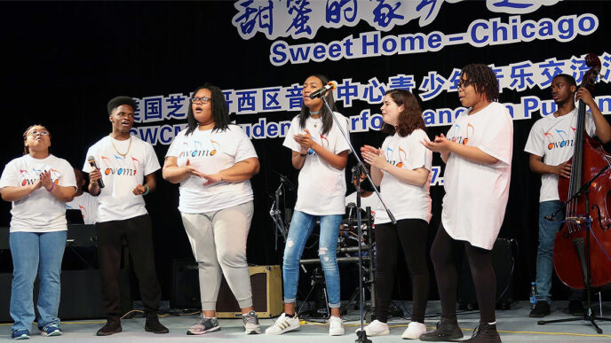 A group of young musicians perform on a stage