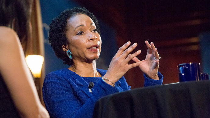 Dr. Helene Gayle seated on stage