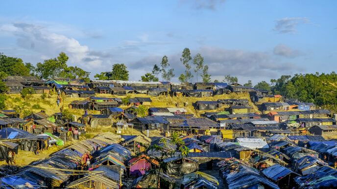 Rows of tents and bamboo shelters
