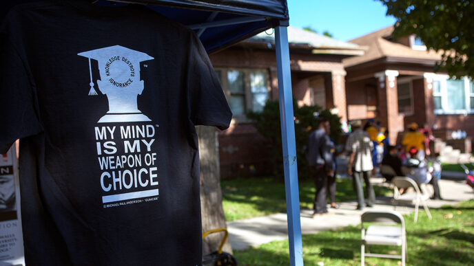 A t-shirt reading My Mind is My Weapon of Choice hangs from a tent. In the background
