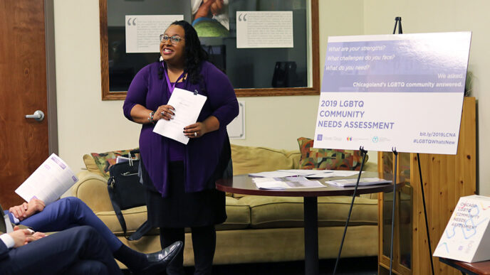 A smiling woman holds a report