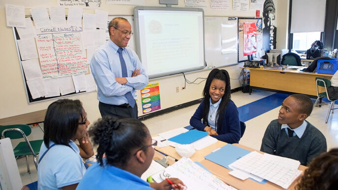 A man stands in a classroom
