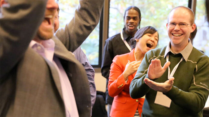 A group of people clap